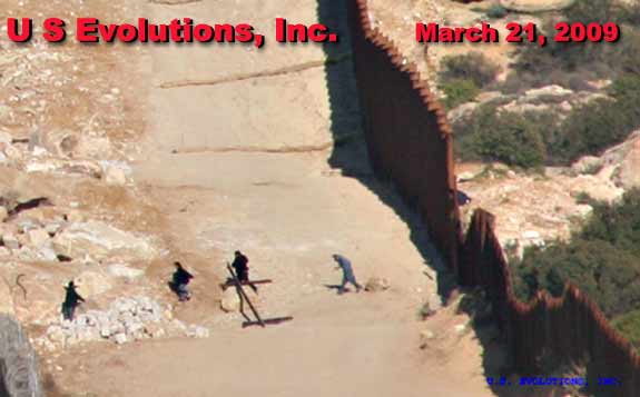 illegal aliens crossing border fence